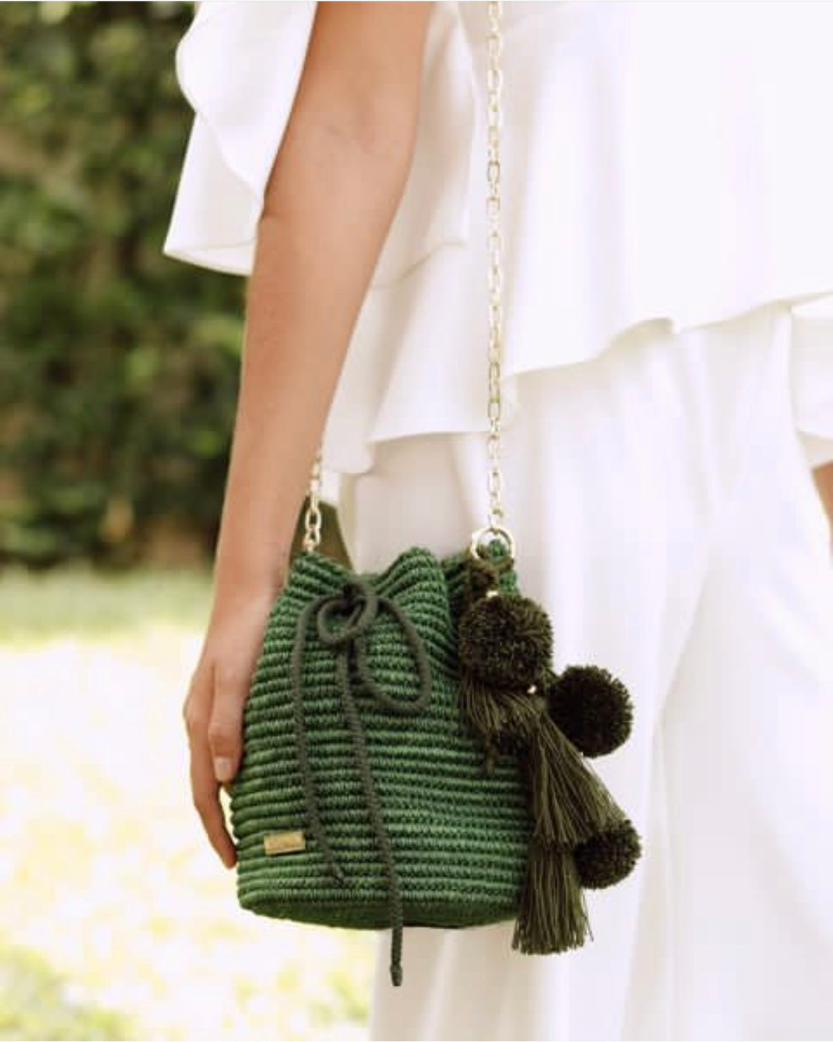 Bucket bag with Pom Poms