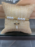 Gold bracelet w/pearls and cross charm